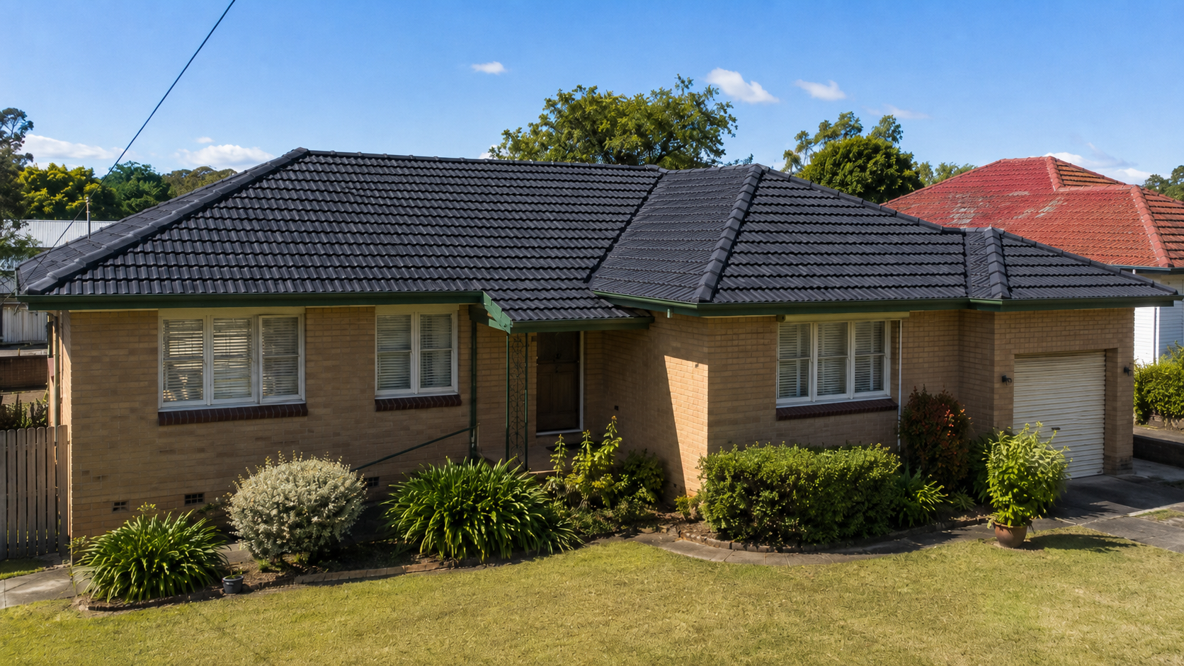 Freshly restored tiled roof showing Weatherproof workmanship