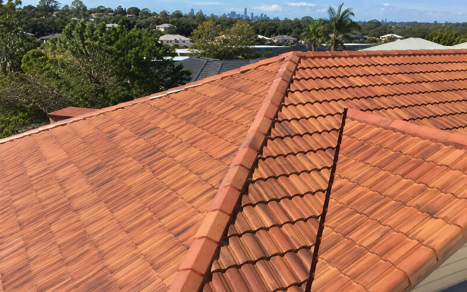 Clean terracotta tiled roof after professional roof cleaning